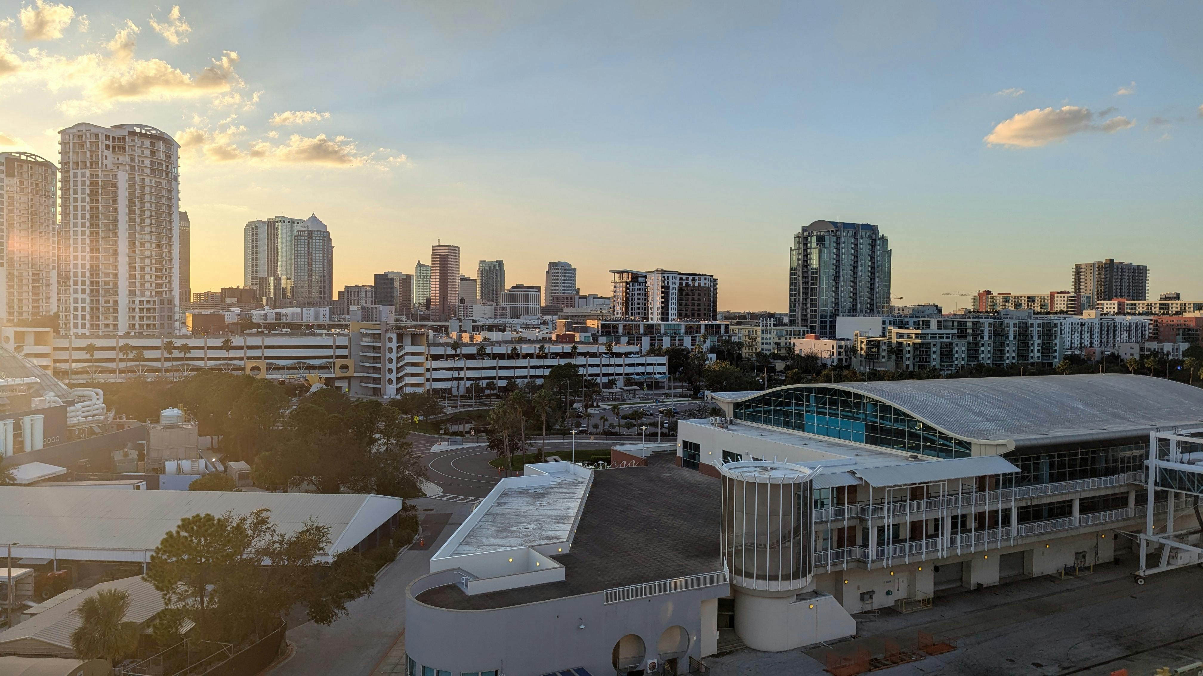 Modern city skyline at sunset.